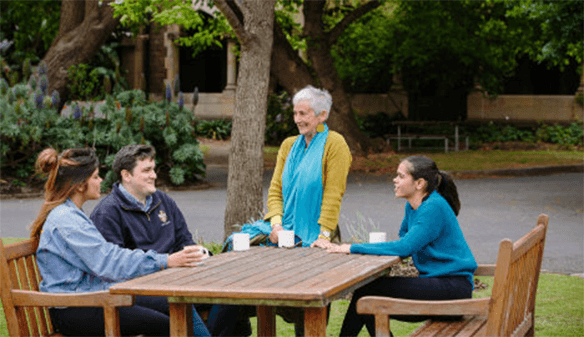 indigenous students and staff engaged in conversation on the ƵappCollege grounds